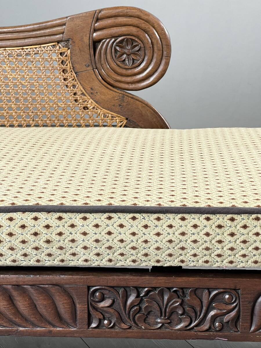 Louis XVI style meridian in carved wood and caning, 19th century.