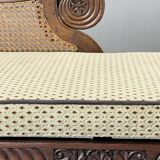 Louis XVI style meridian in carved wood and caning, 19th century.