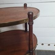 Oval mahogany side table has 3 floors