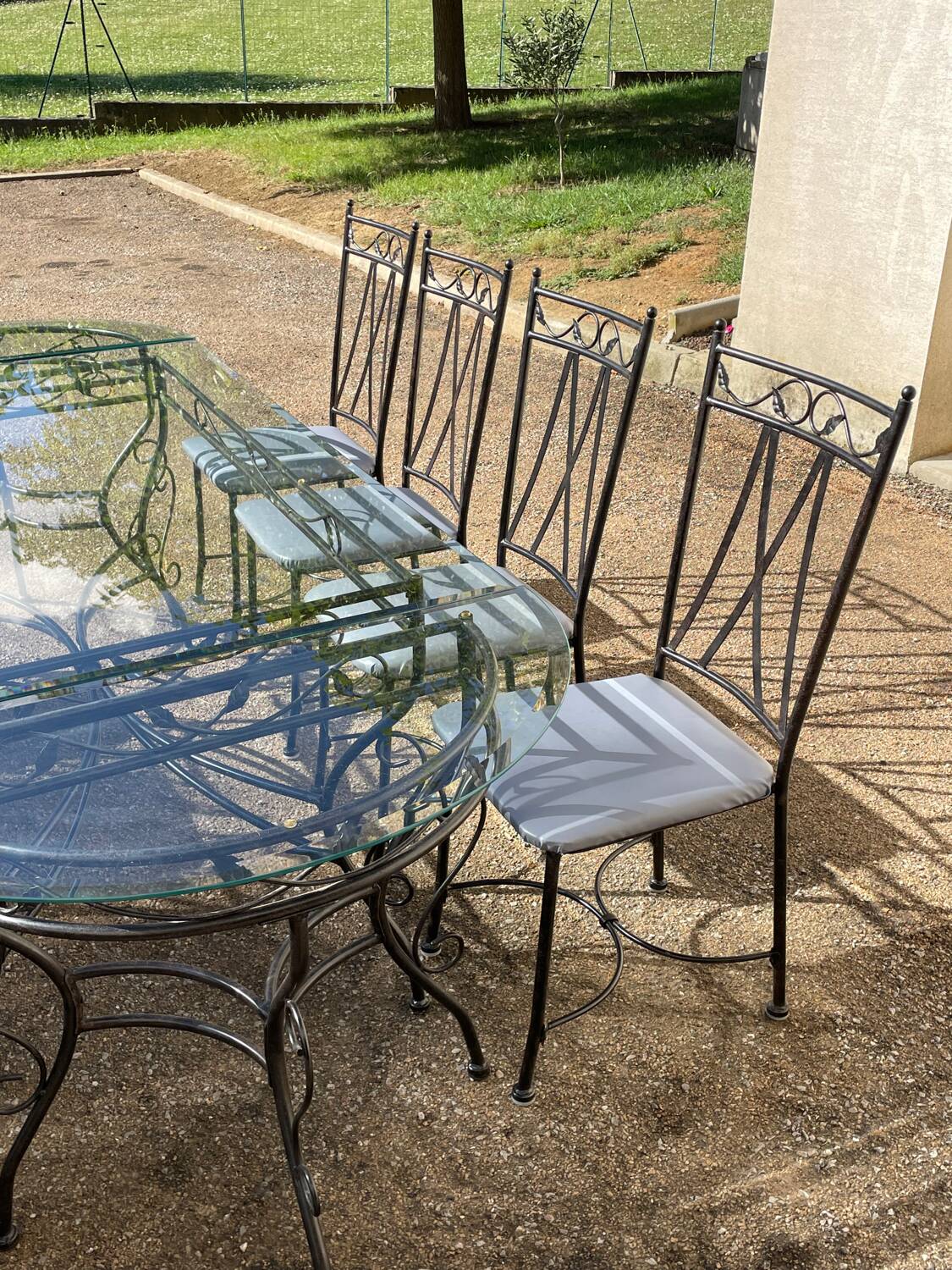 Glass and iron table with two side tables and 8 chairs