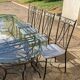 Glass and iron table with two side tables and 8 chairs