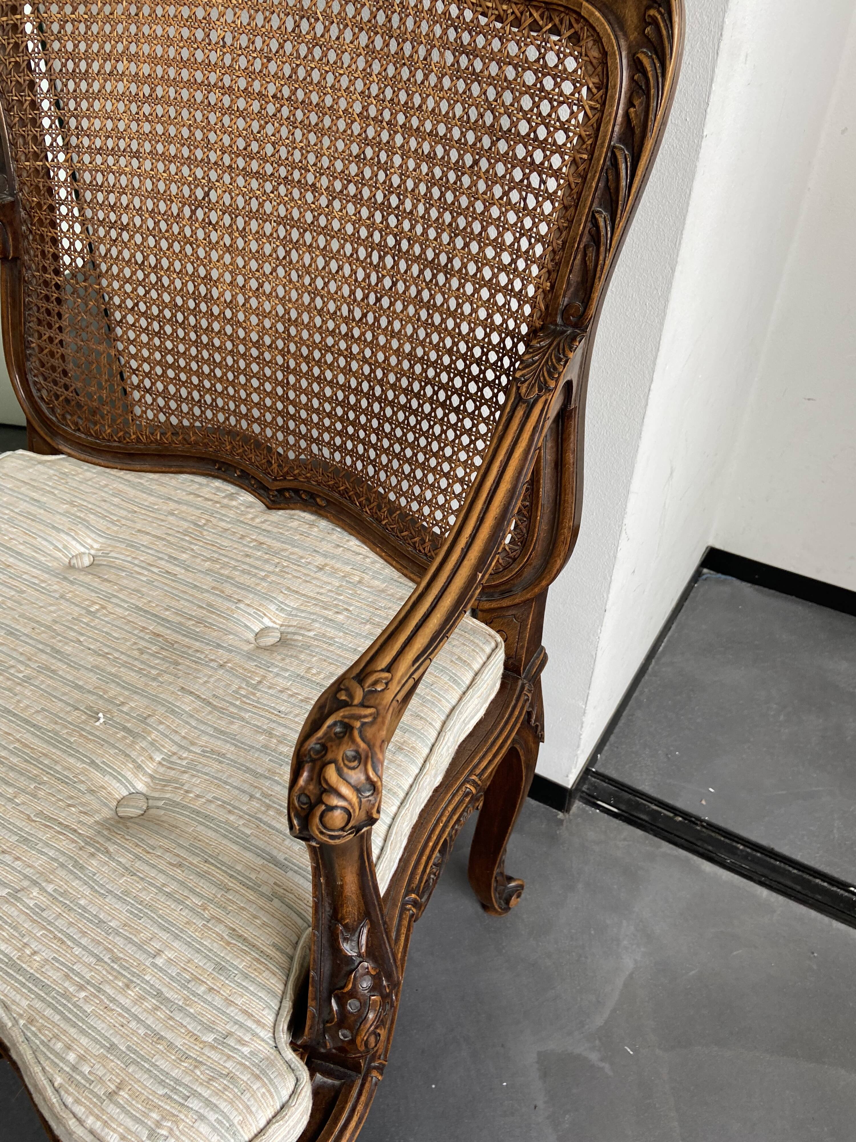 Regency canned armchair in carved walnut