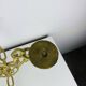 Brutalist candle holder, wrought iron, chain links, gold patina.