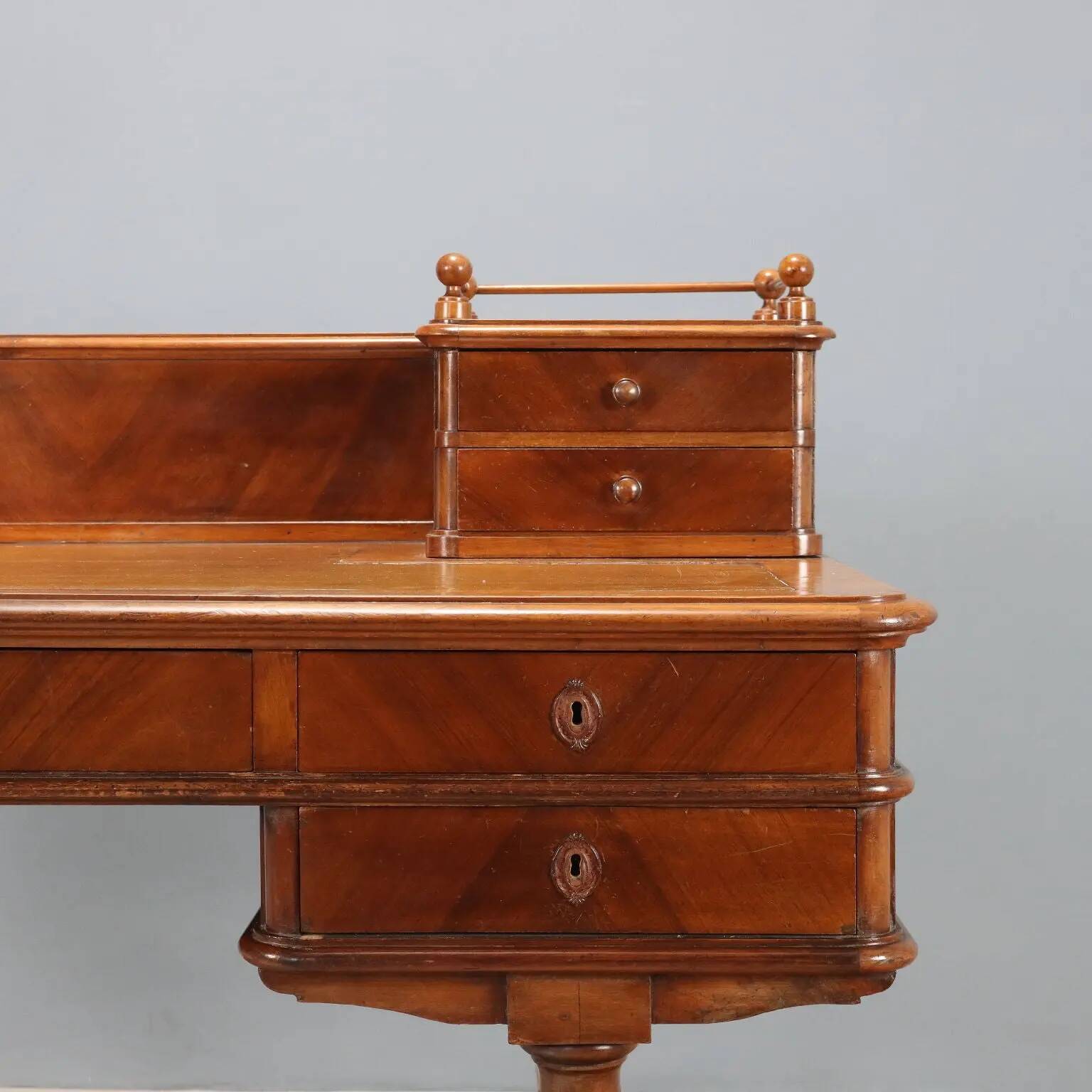 Antique walnut desk with a leather-covered top, Italy, late 19th century.