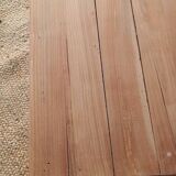 Low farmhouse table in raw wood