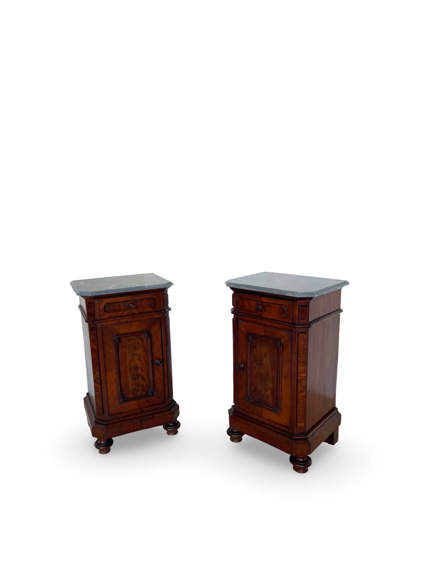 A pair of antique walnut bedside tables from the 1890s.