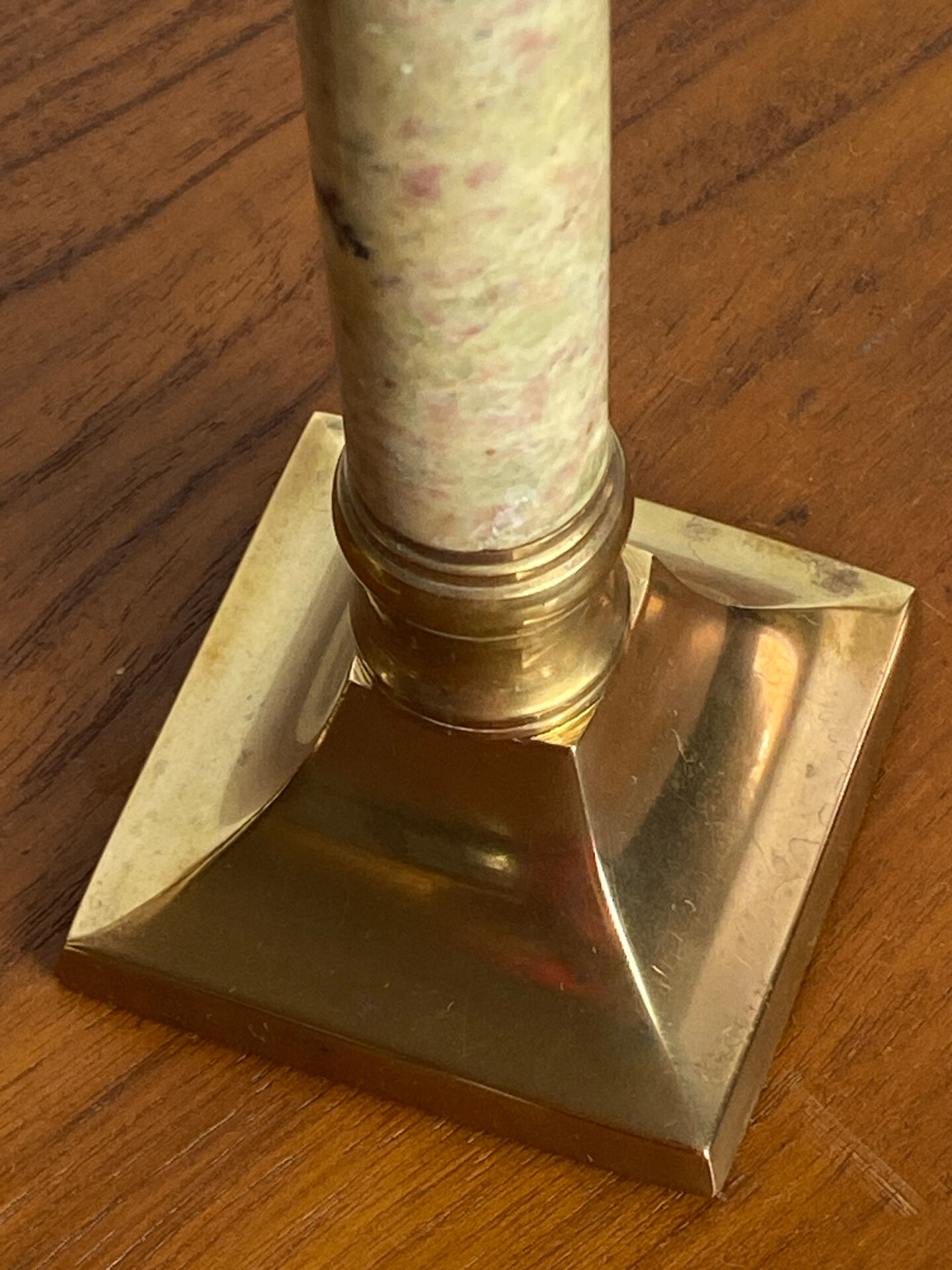 Pair of brass and stone candlesticks