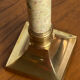 Pair of brass and stone candlesticks