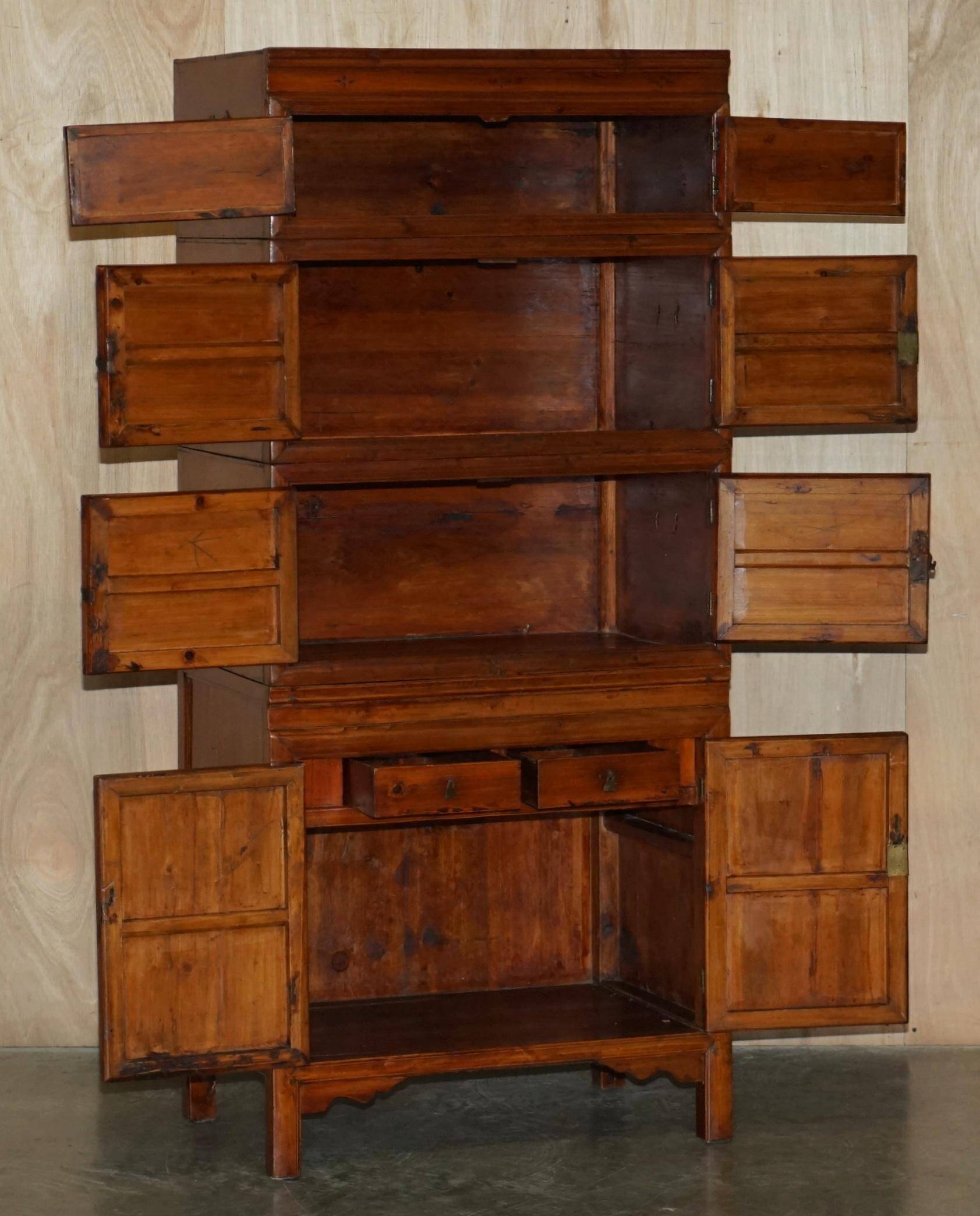 Antique Chinese armoire hand-carved around 1880 with country-style handles.