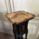 A pedestal table in blackened wood and burl veneer, superb assembly of moldings circa 1880
