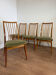 Scandinavian chairs with green velvet upholstery.