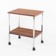 Vintage side table on wheels. Chrome-plated iron tube and wood. France, 1970s.