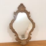 Bakelite scrolled mirror with rocaille pediment