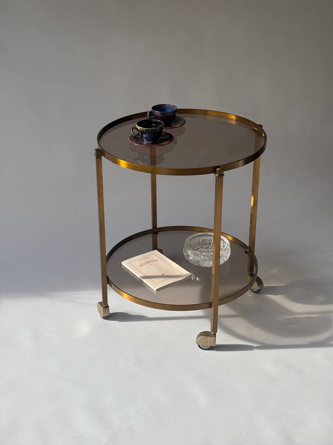 Rolling dessert trolley in brass and smoked glass, 1960