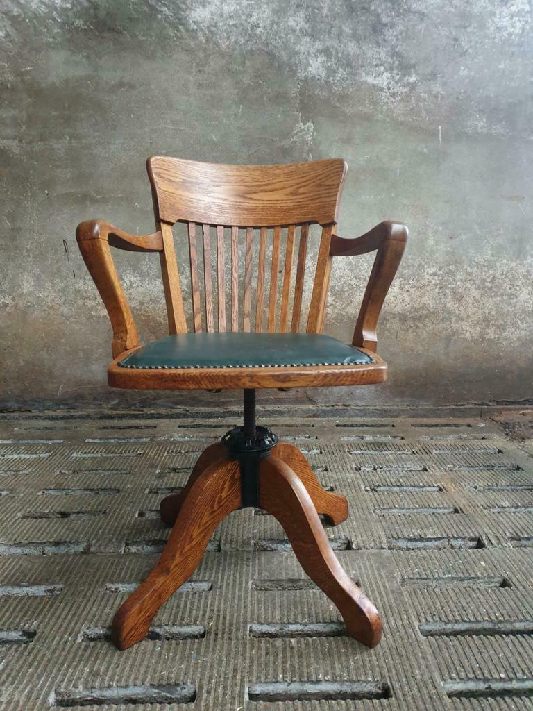 Antique office chair oak adjustable with green leather