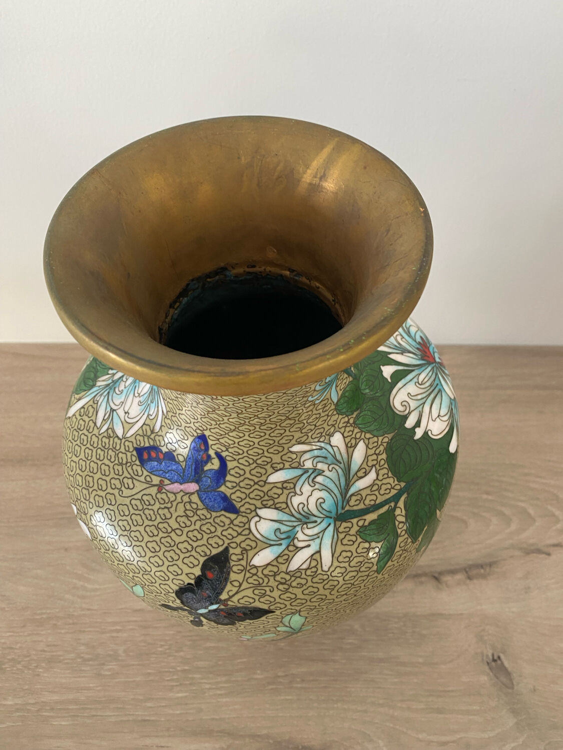 Chinese cloisonné vase decorated with flowers and butterflies.