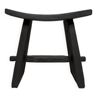 Curved burnt wood stool