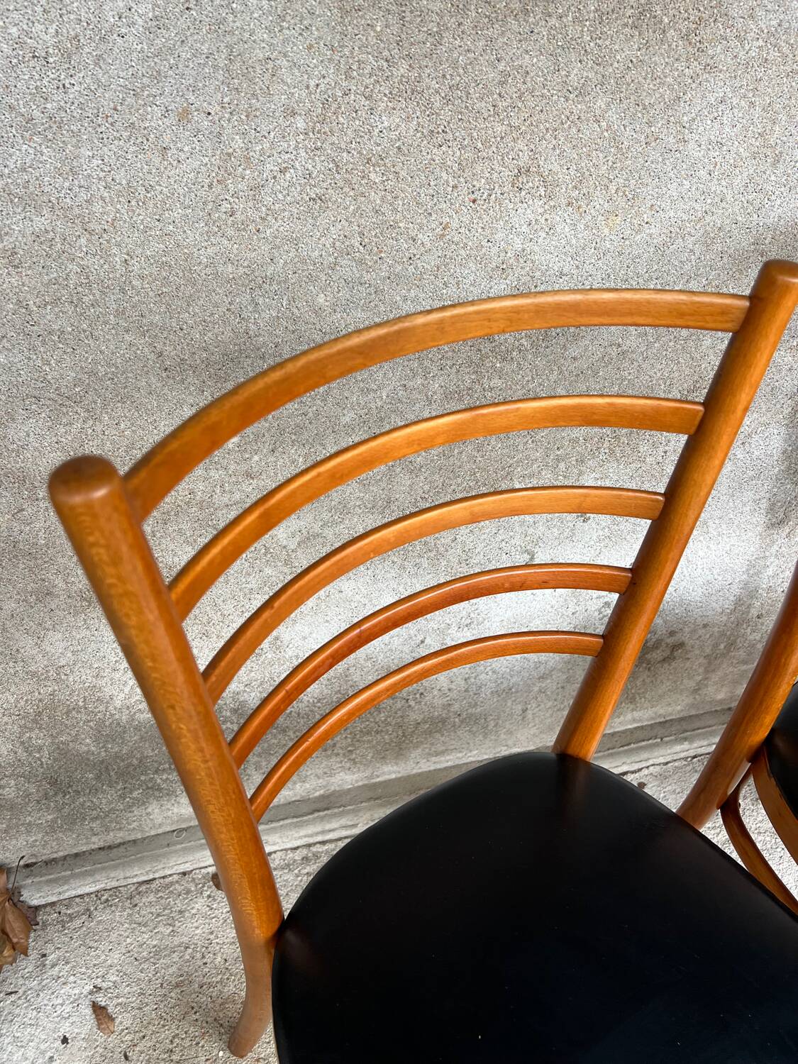 Set of 4 vintage wooden chairs with faux leather.