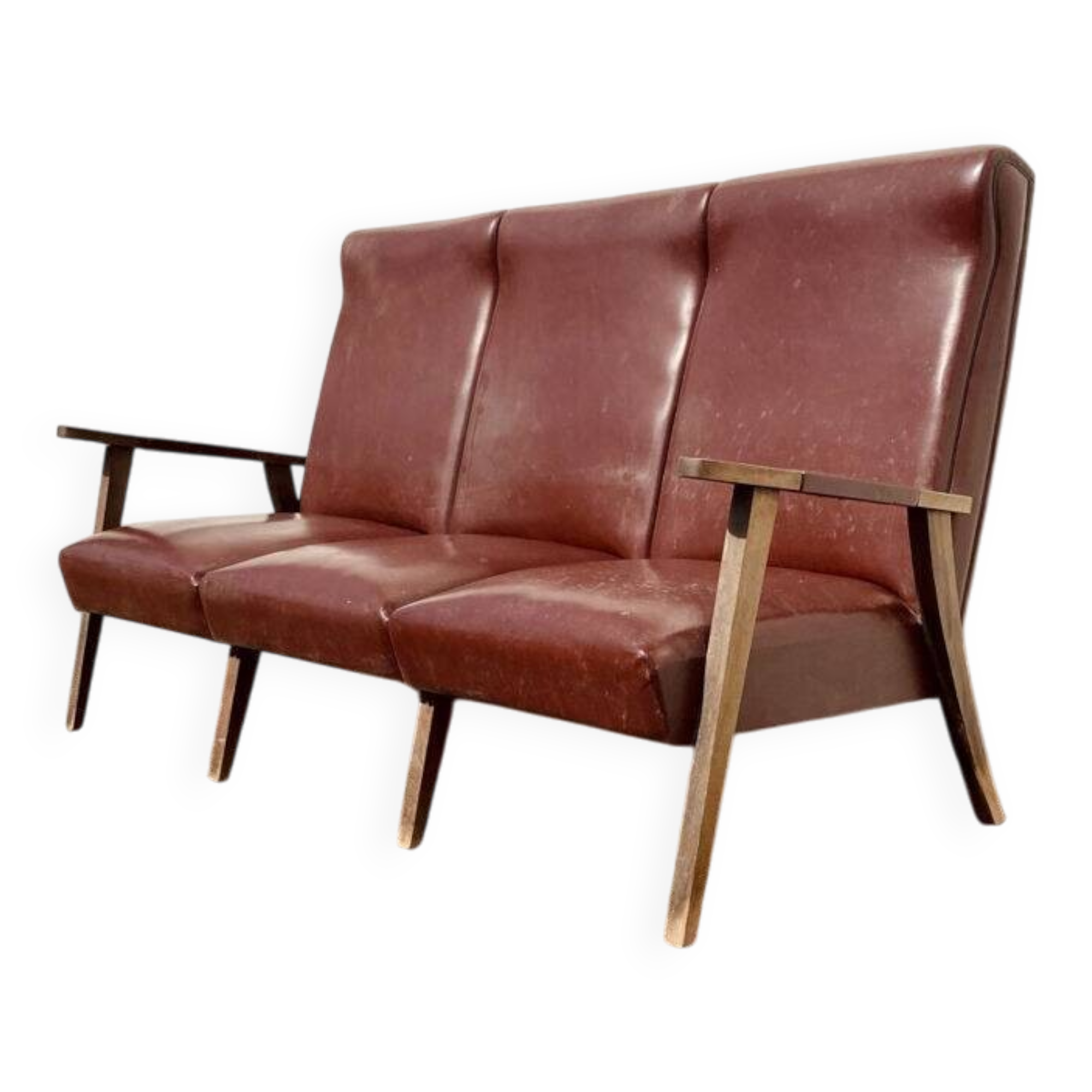 Three-seater patinated leather sofa, mid-century style.