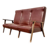 Three-seater patinated leather sofa, mid-century style.