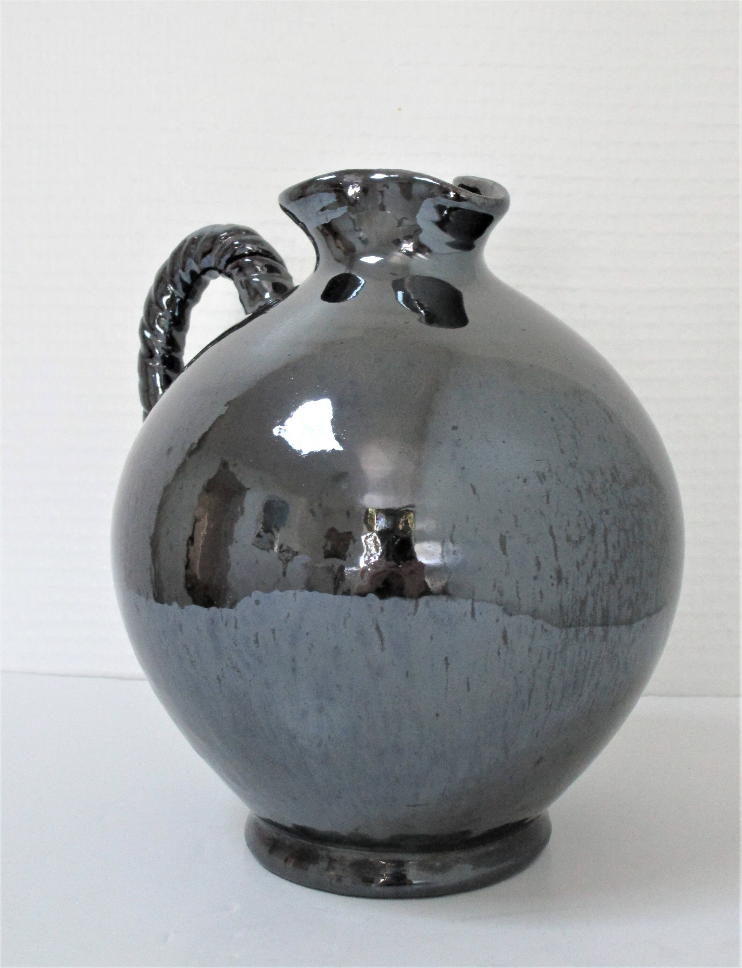 Black pearl glaze ceramic pitcher by Reinhold Rieckmann signed
