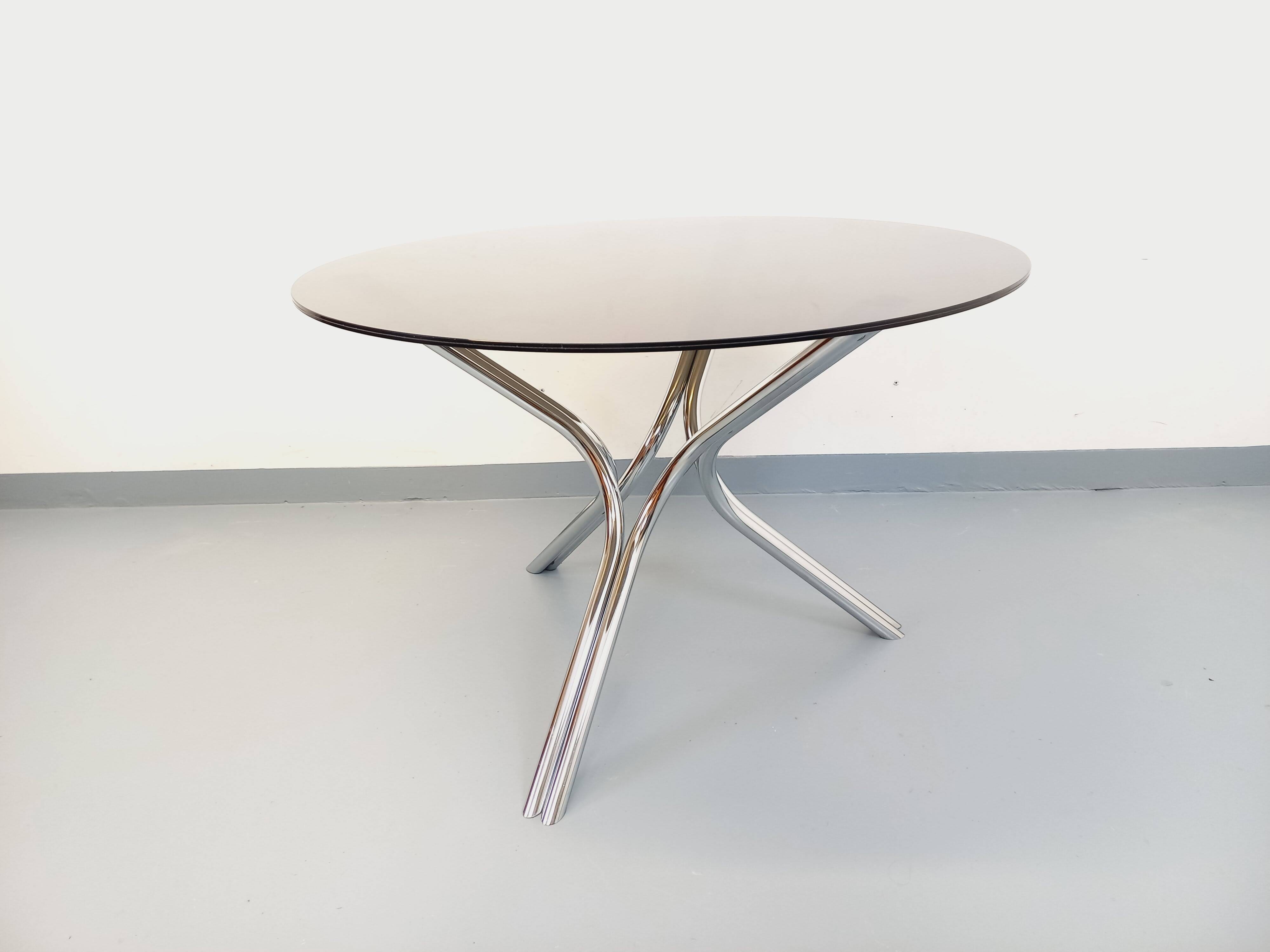 Vintage dining table in smoked glass plexiglass and chrome metal.