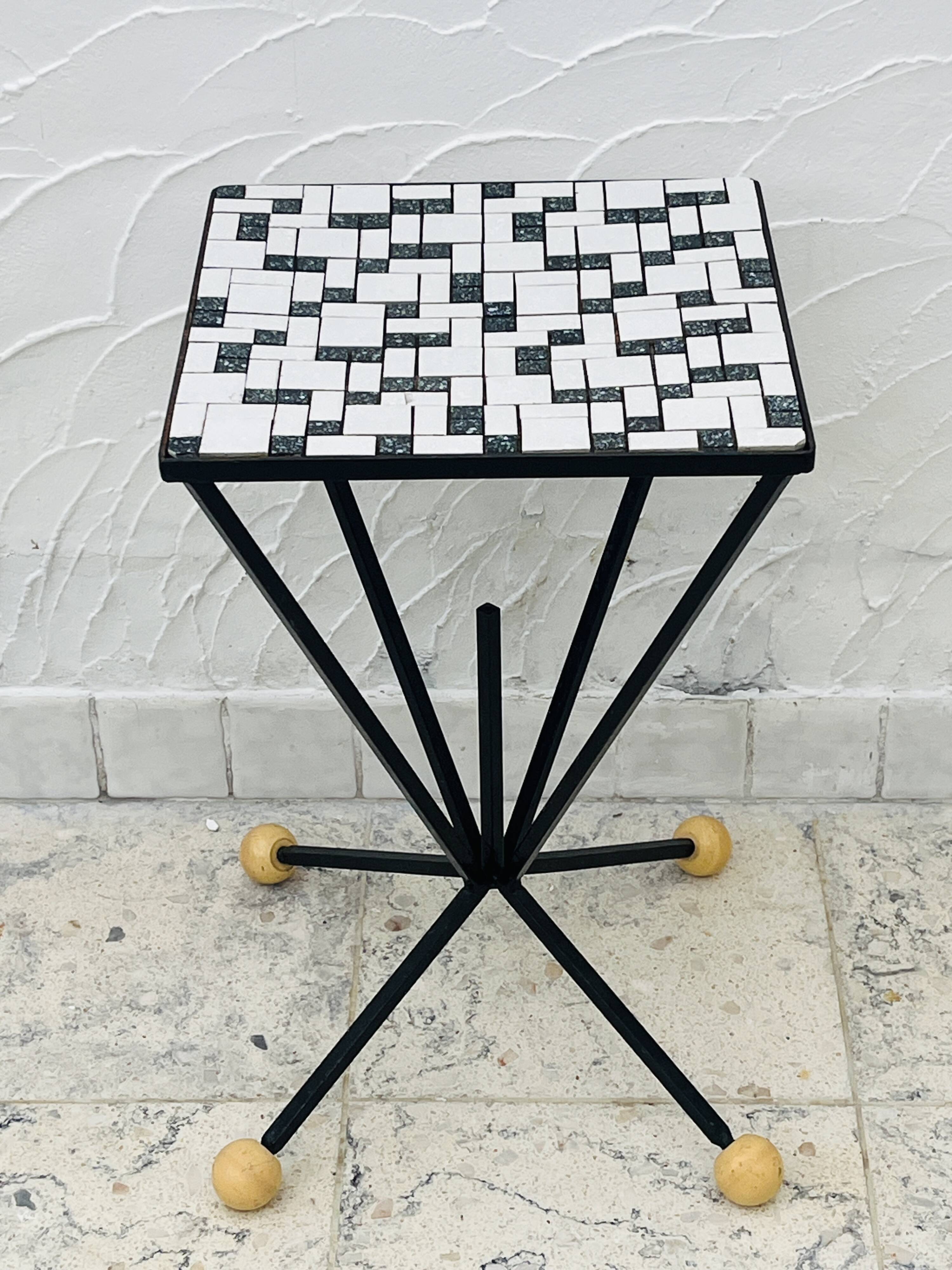 Wrought iron stela and black and white tiled top from the 1960s.