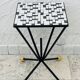Wrought iron stela and black and white tiled top from the 1960s.