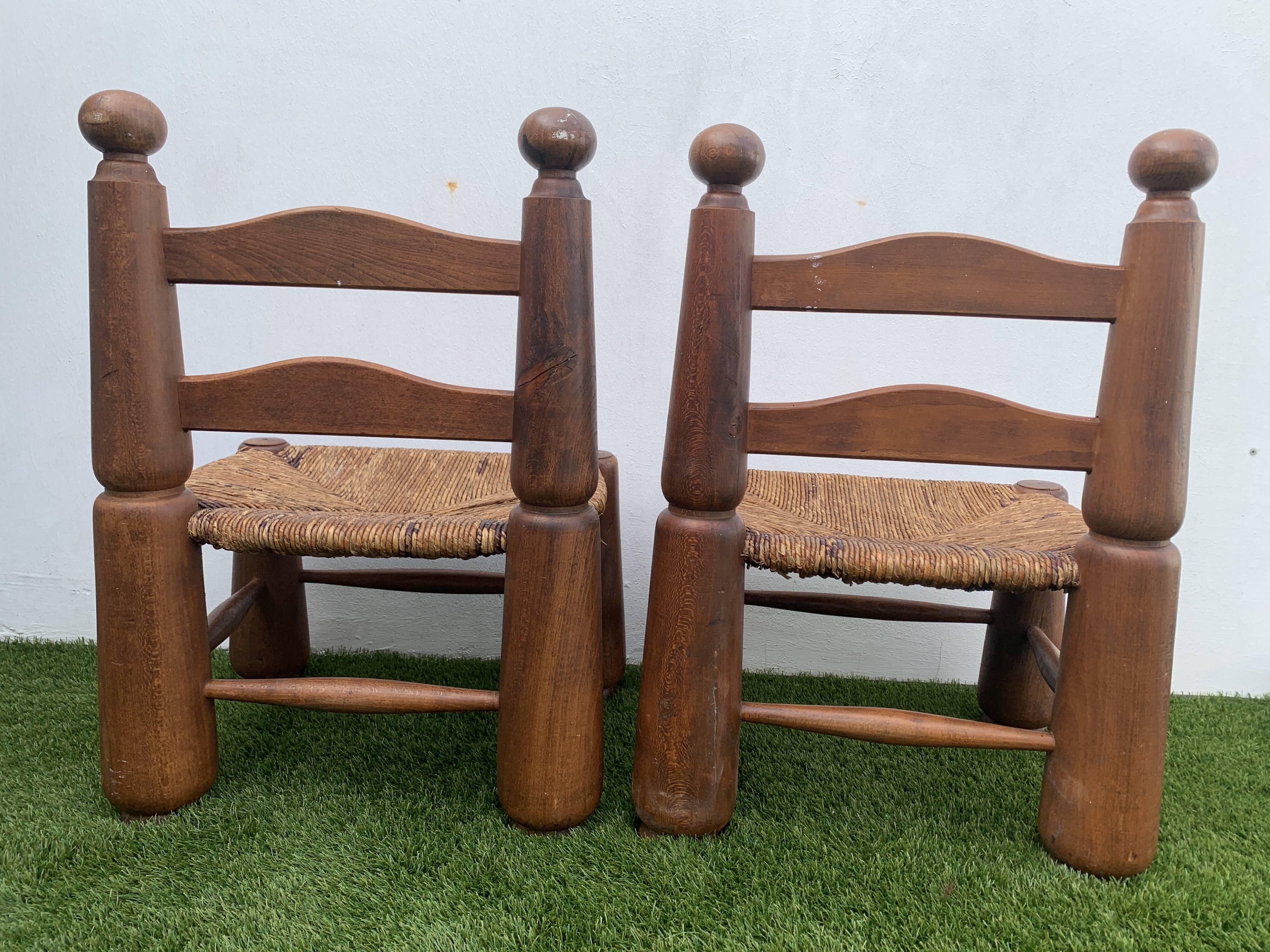 Pair of antique low fire chairs made of wood and straw