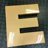 Golden sign letter E
