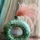 Handmade terracotta donut vase in light green terracotta
