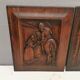 Four old wooden carvings to hang on the wall.