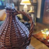 Glass demijohn encased in wicker, 1950s–1960s