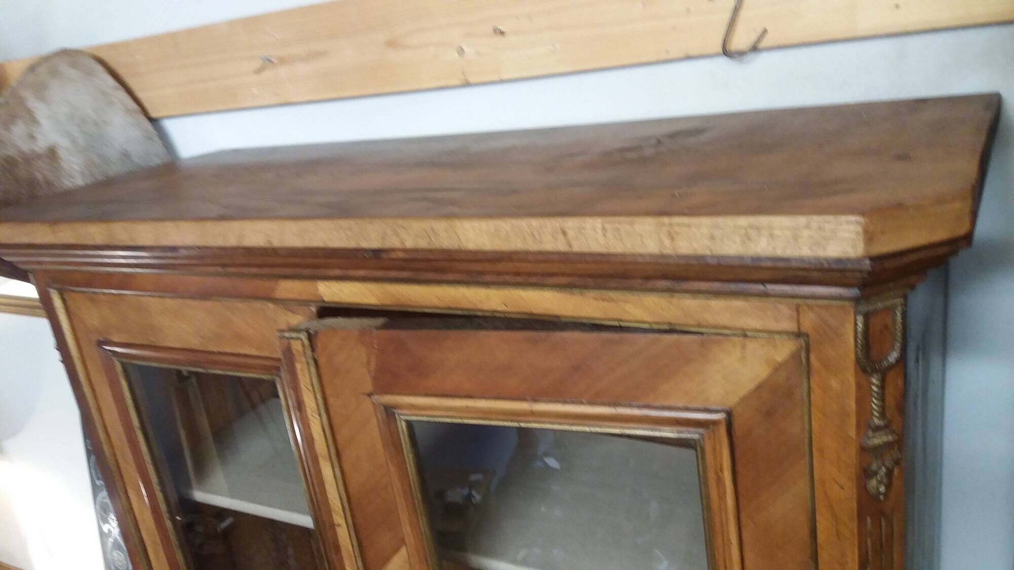 Two-door display cabinet in transitional style.