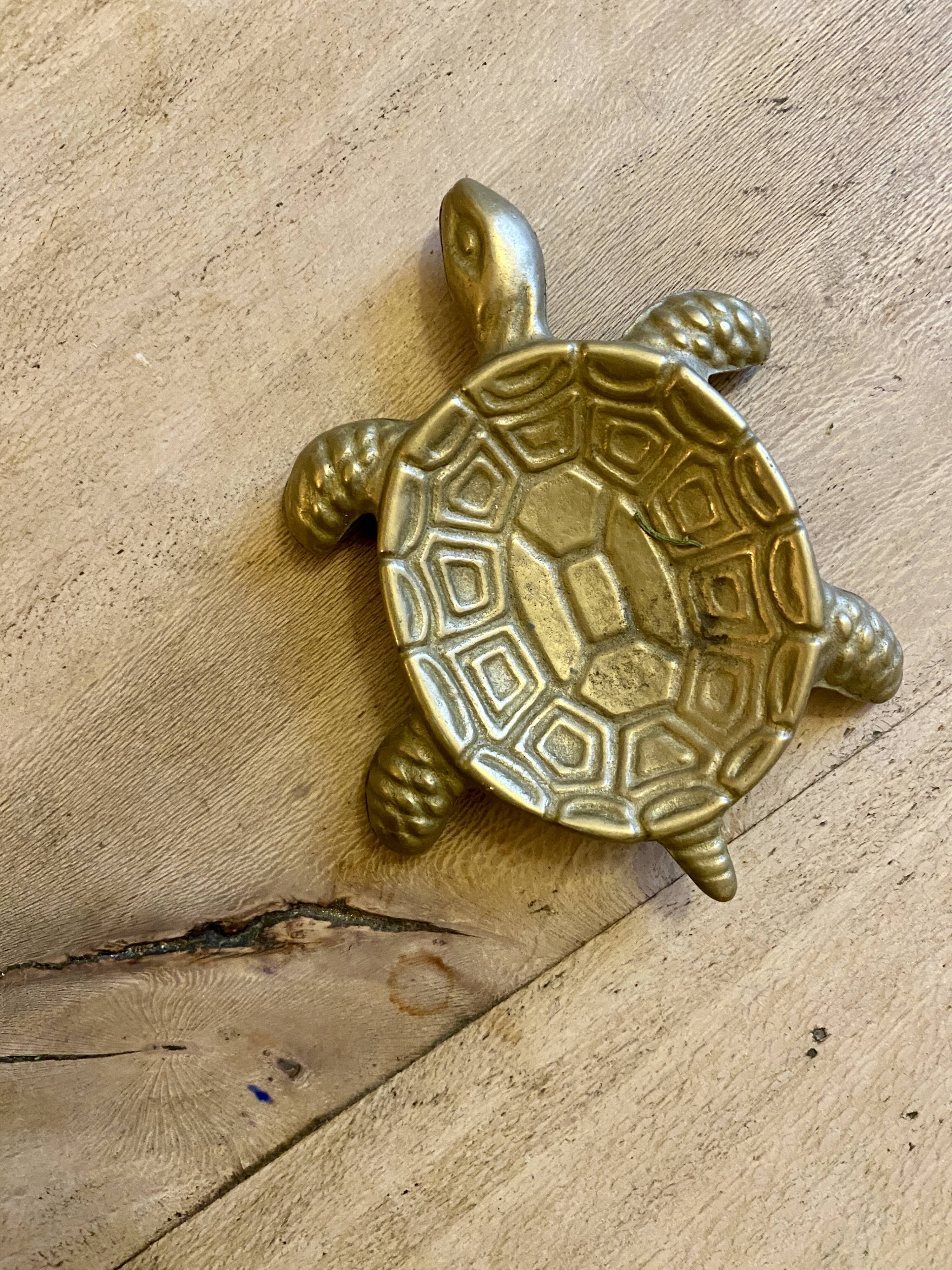 Vintage brass turtle pocket emptier