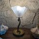 Table lamp with brass fish and draped glass tulip.