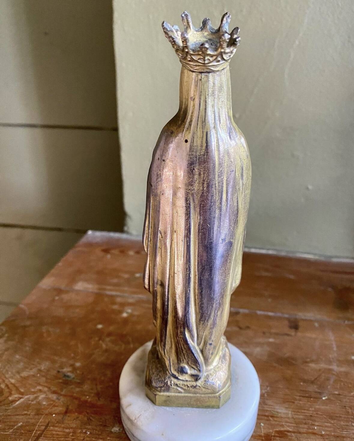 Virgin Mary crowned in metal and brass