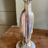 Virgin Mary crowned in metal and brass