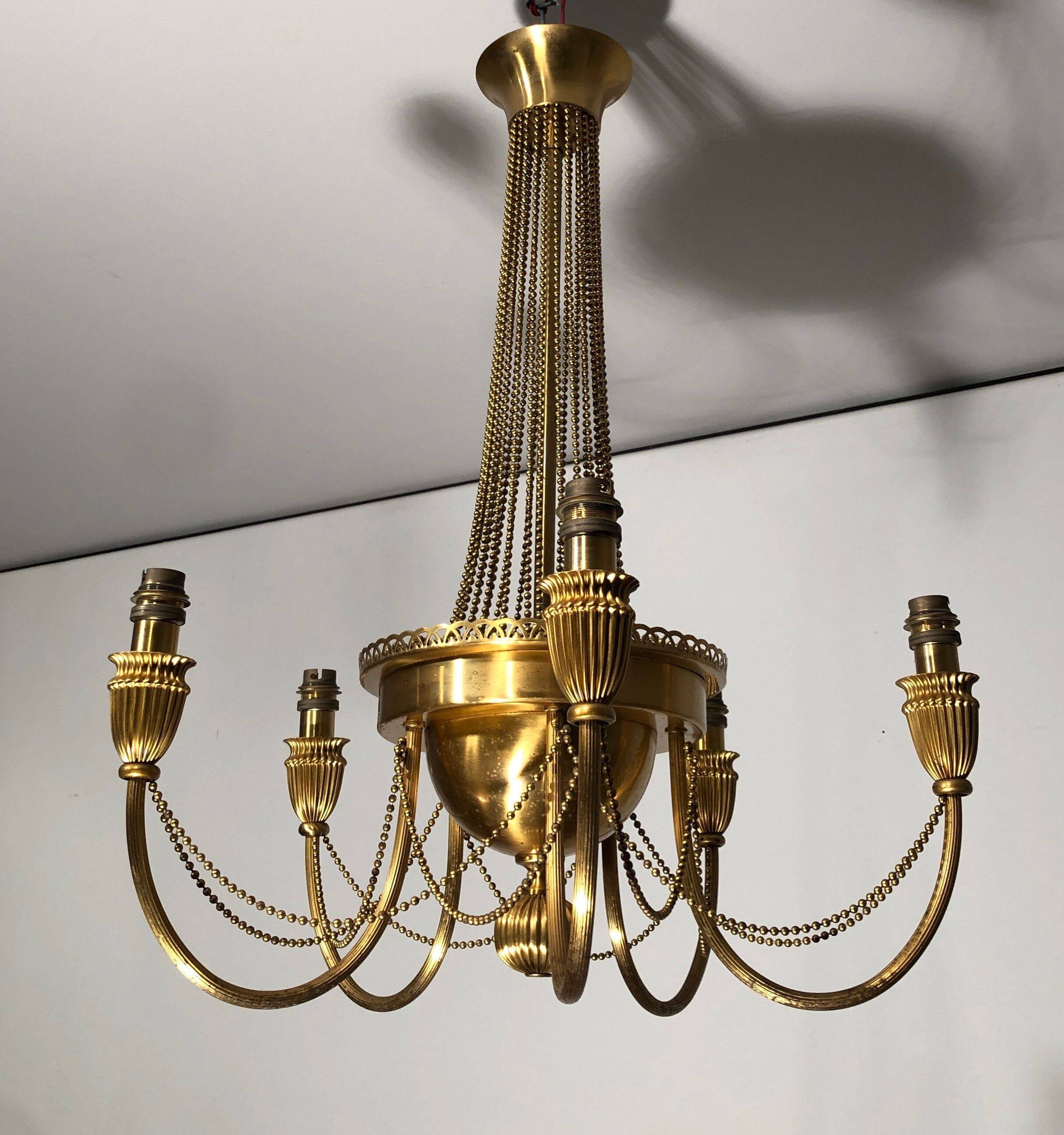 Neoclassical style brass chandelier decorated with pearl garlands
