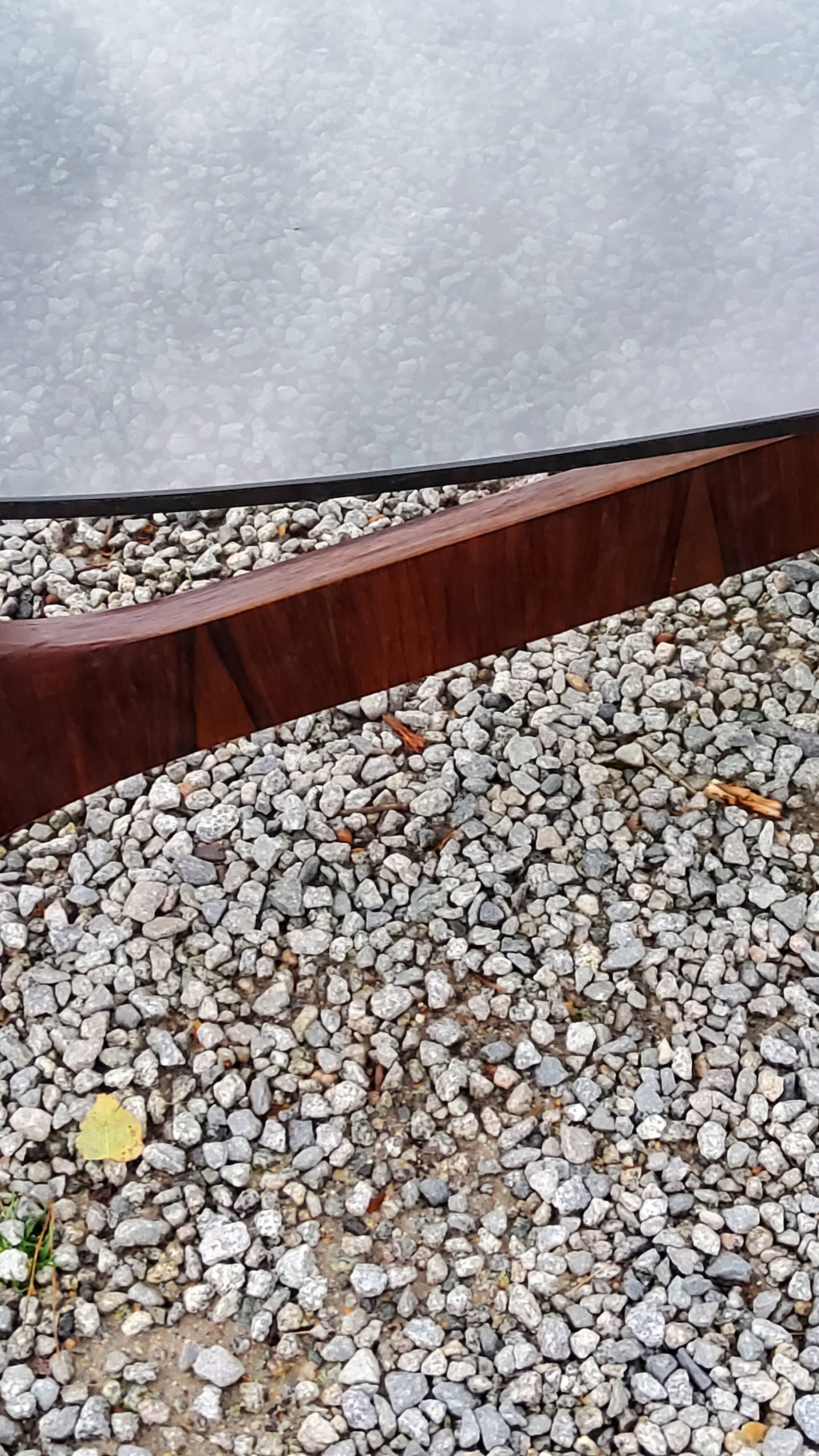 Designer coffee table by Hugues Poignant in rosewood and smoked glass from the 70s