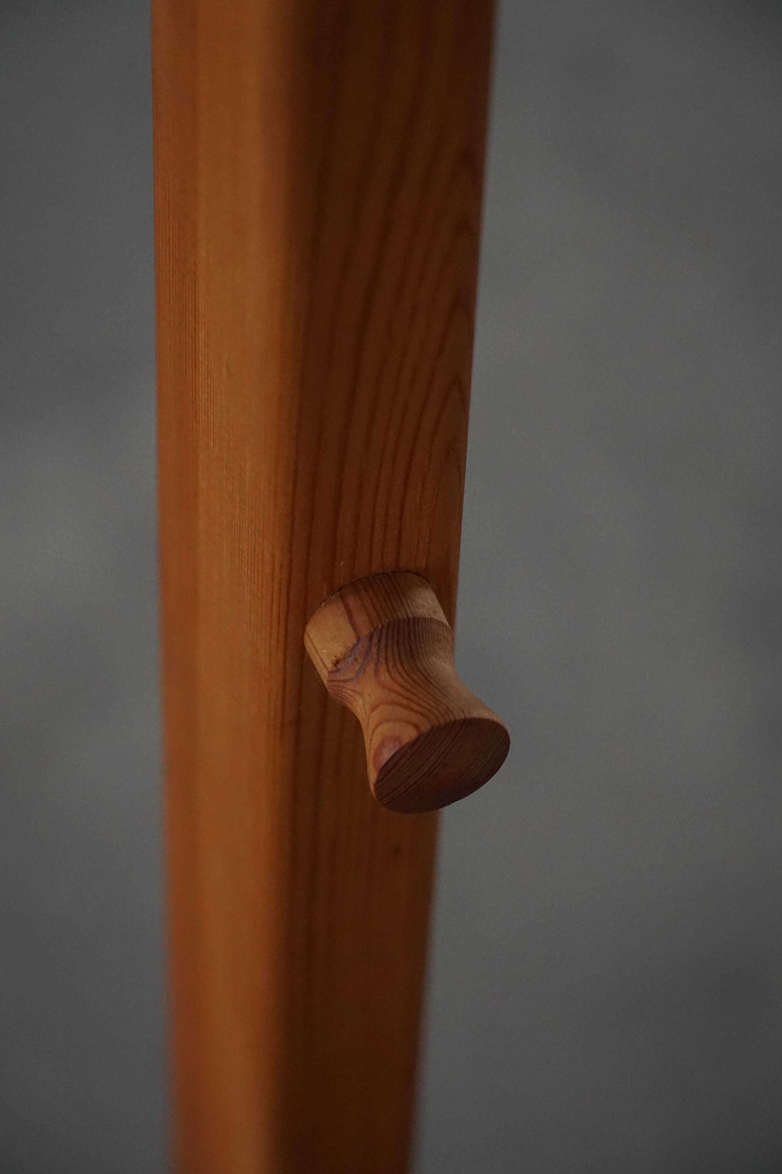 Modern Danish, brutalist round coat rack in solid pine, cylindrical shape, 1970s.