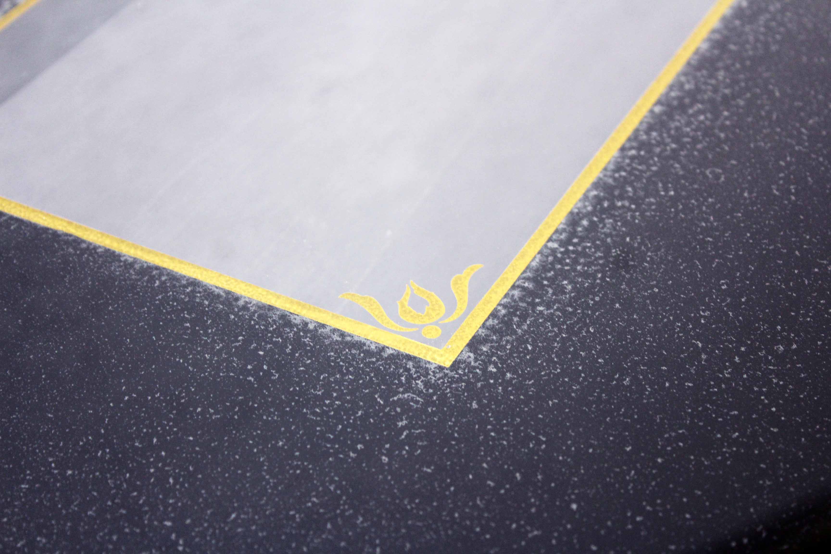 Low table with compass feet with decorative cabinet