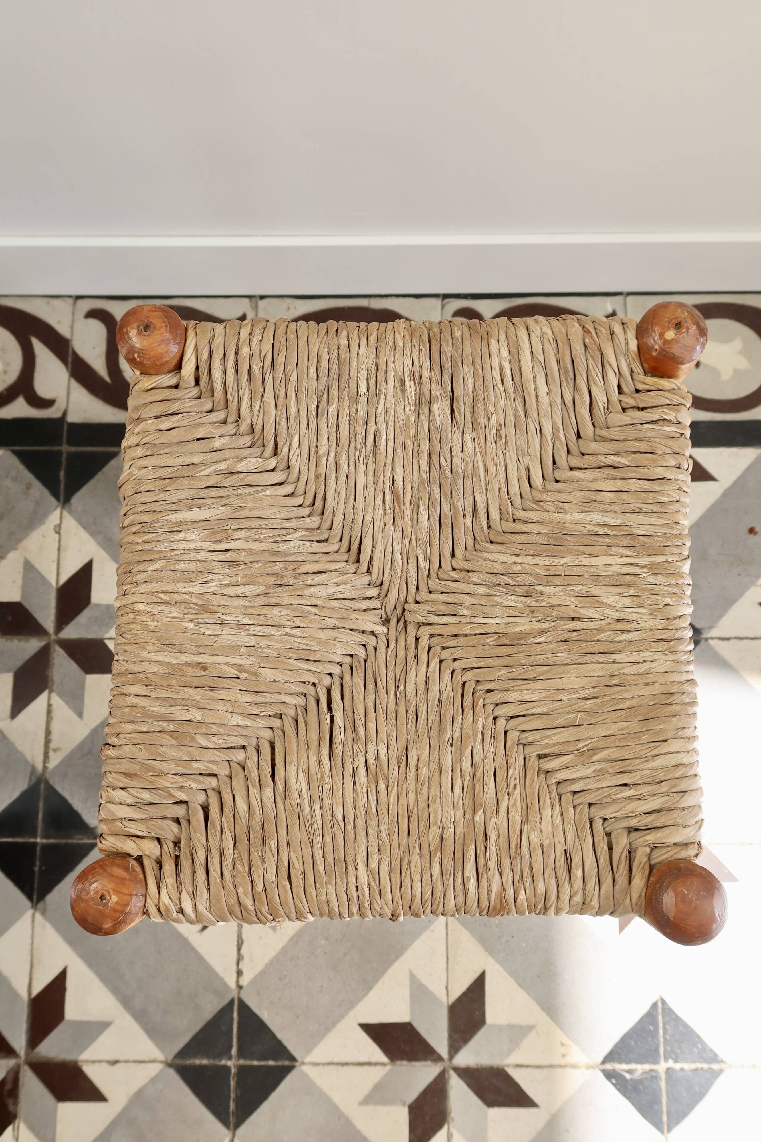 Vintage low stool in wood, honey yellow tones – Woven seat