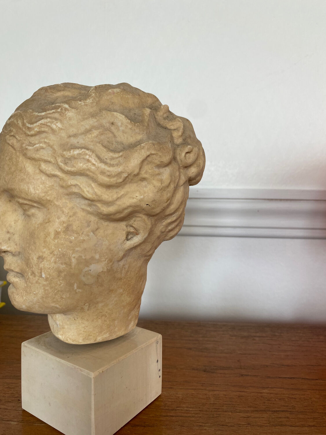 Head of a greek goddess in stone