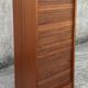 Vintage wooden filing cabinet with curtains.