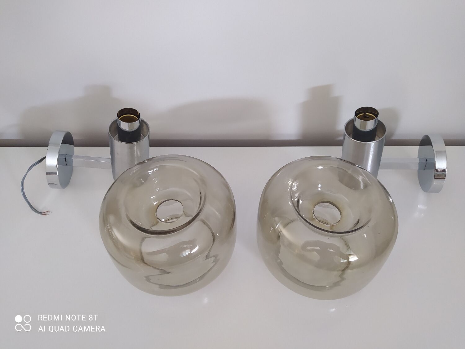 Pair of vintage chrome wall lights with smoked glass globe
