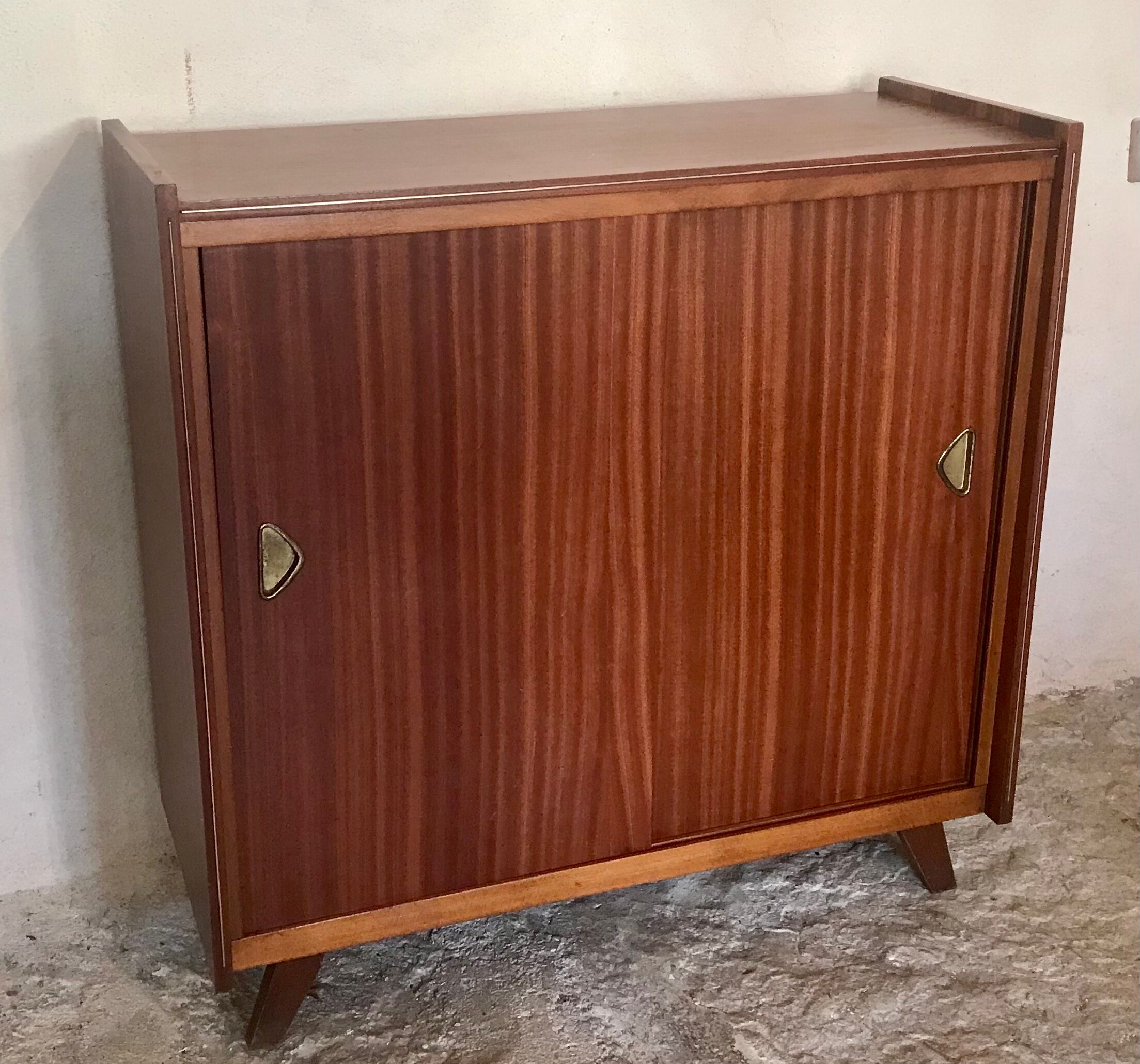 Vintage storage cabinet teak veneer sliding door compass feet