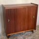 Vintage storage cabinet teak veneer sliding door compass feet