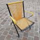 Folding chair in red scoubidou and black metal structure