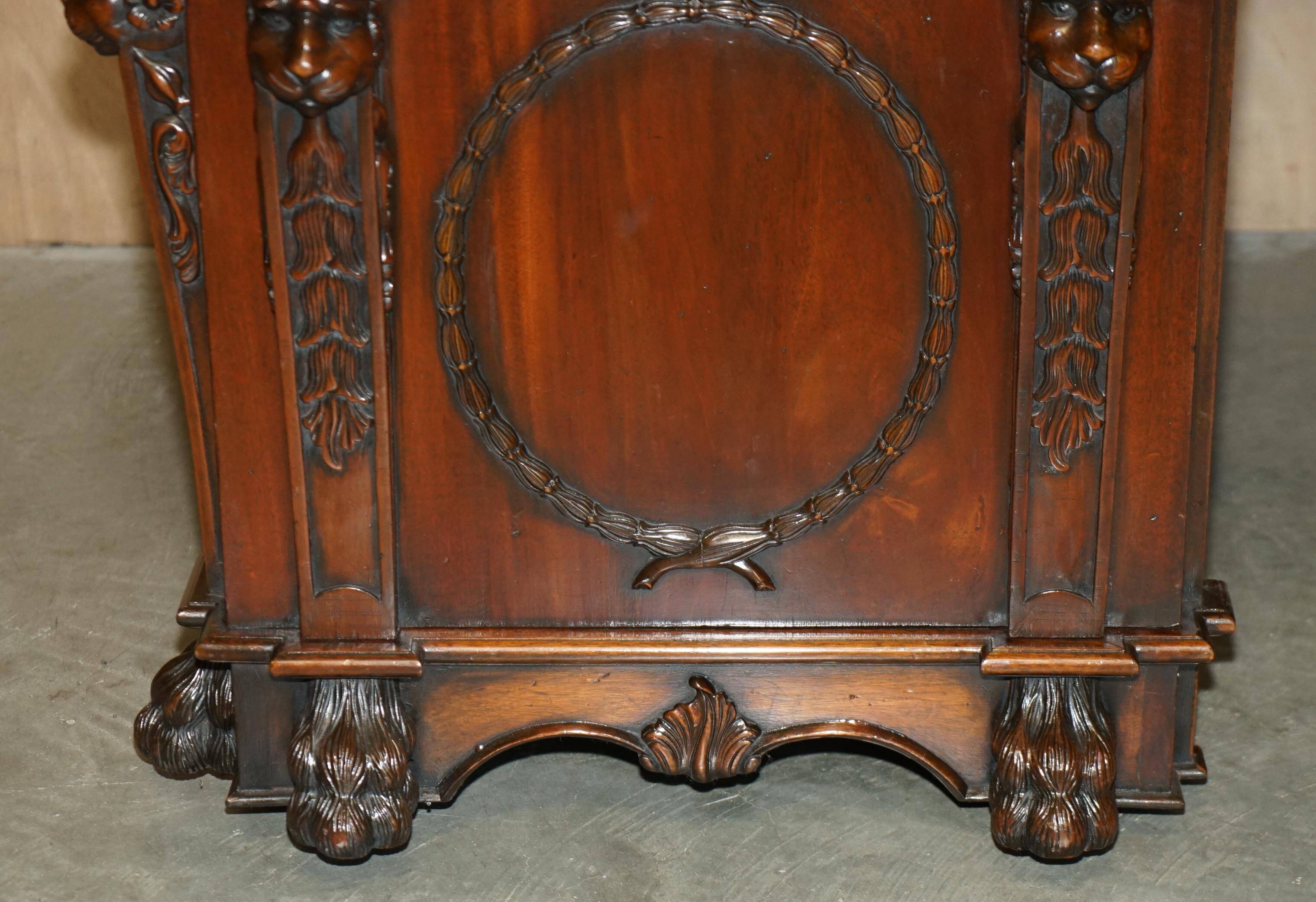 Partner desk with two carved columns featuring lion heads, according to Thomas Chippendale, restored.